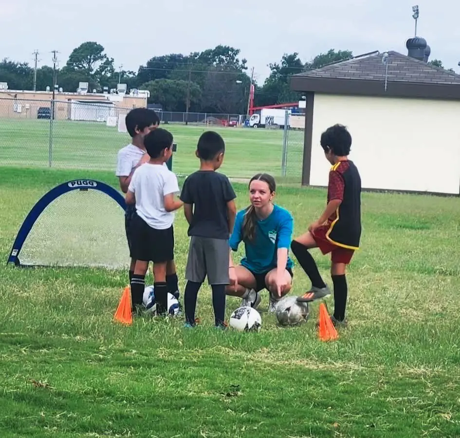 Eva Coaching Soccer