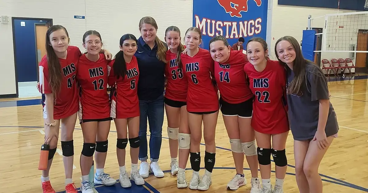 Eva with MIS Volleyball Team